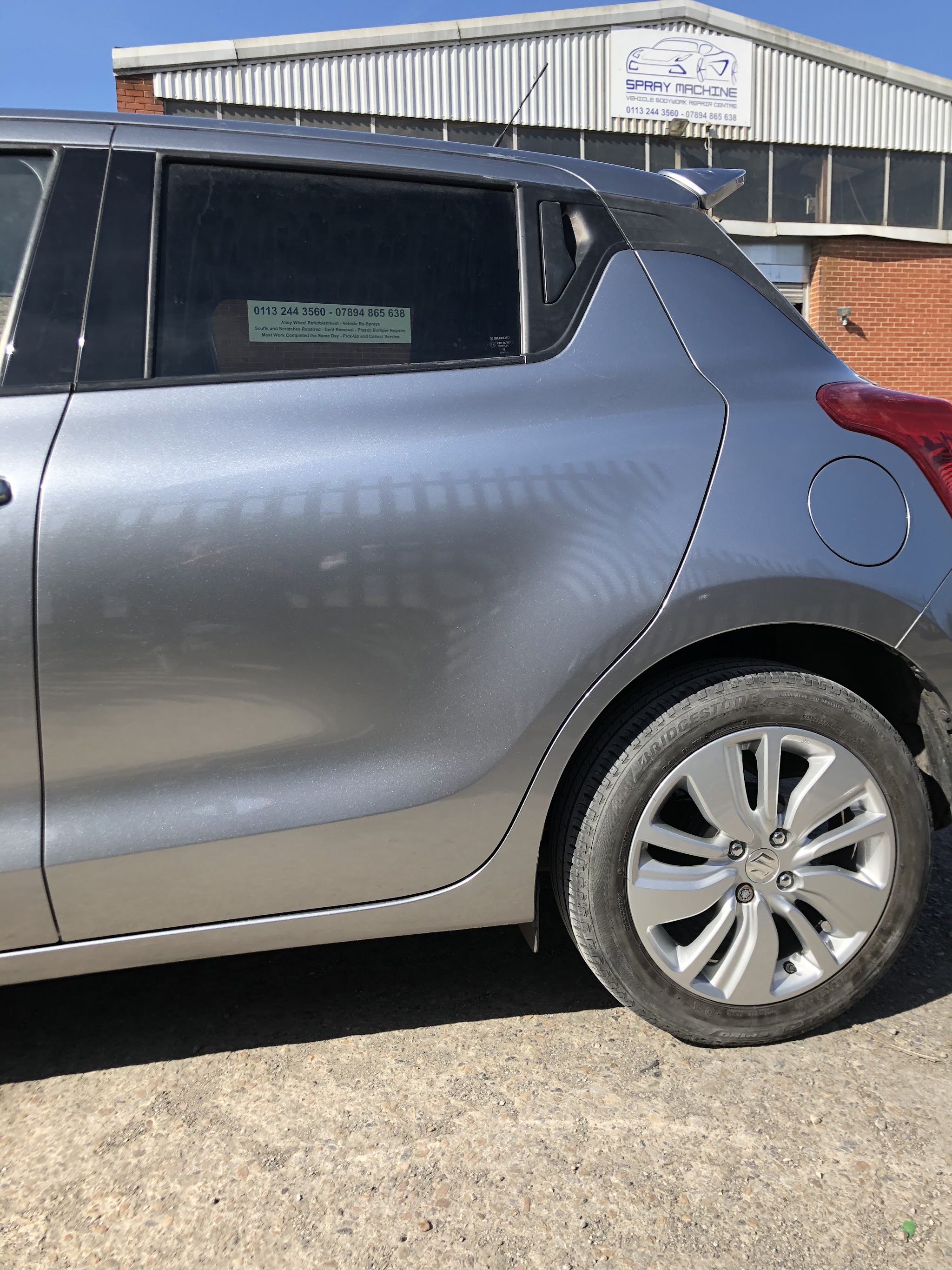 Silver Suzuki rear quarter and door bodywork